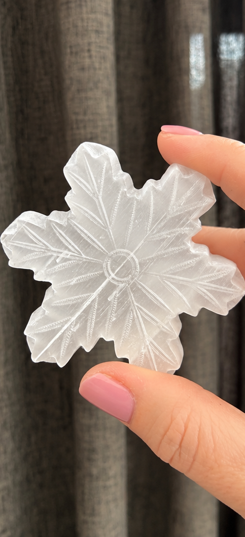 Actual carved white selenite snowflake crystal