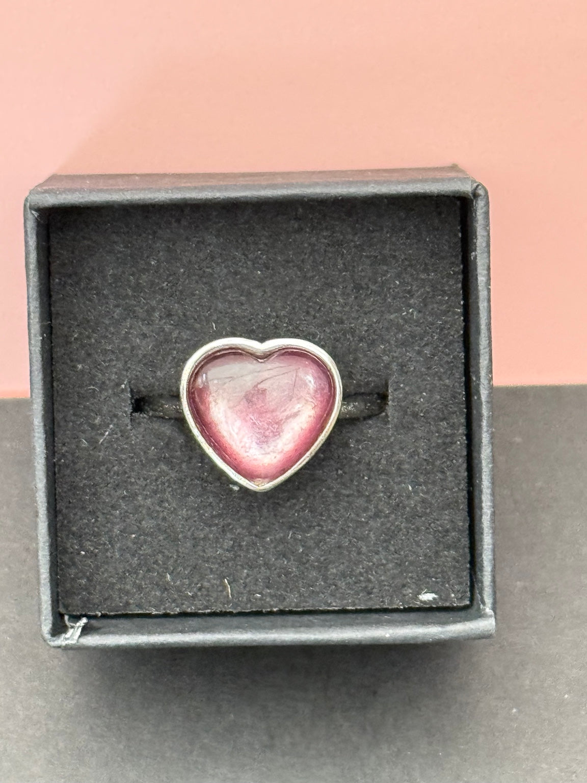 Actual pink lepidolite heart ring in black presentation box