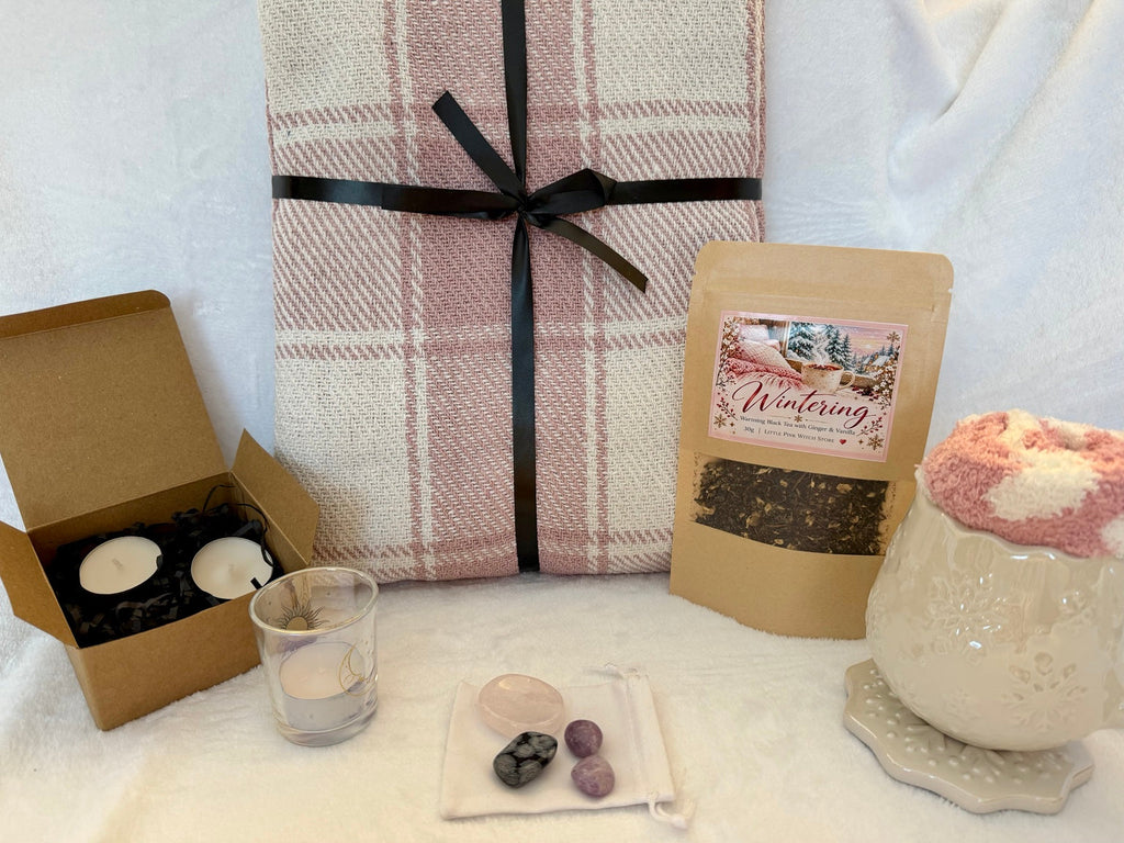 Wintering Cosy gift bundle with pink throw, snowflake mug, tea, candles and crystals