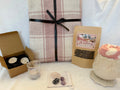 Wintering Cosy gift bundle with pink throw, snowflake mug, tea, candles and crystals