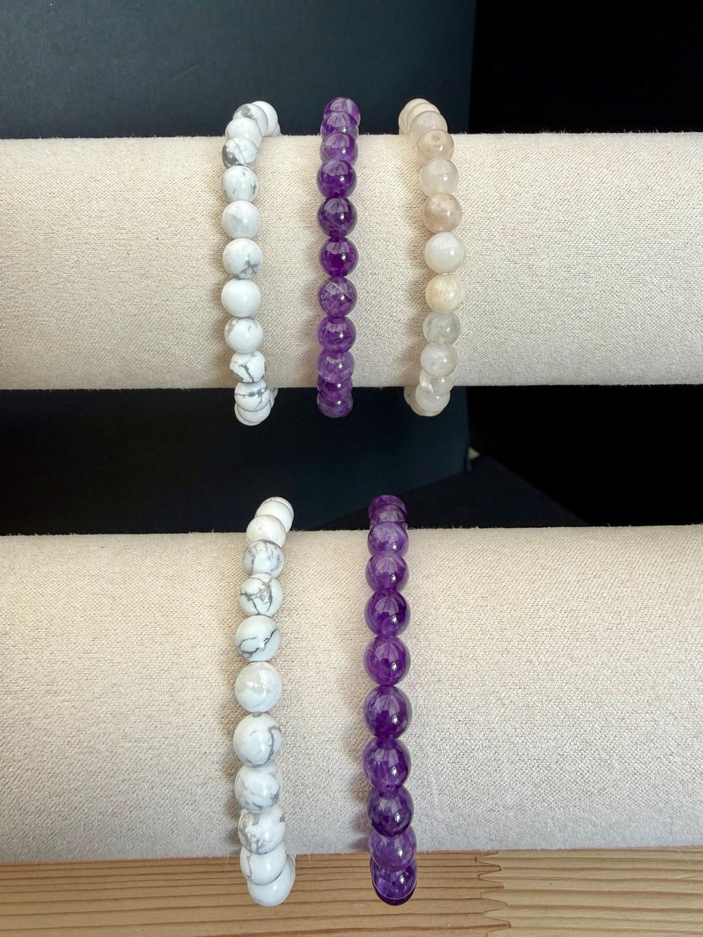 Close-up of Amethyst Howlite and Moonstone bracelet set