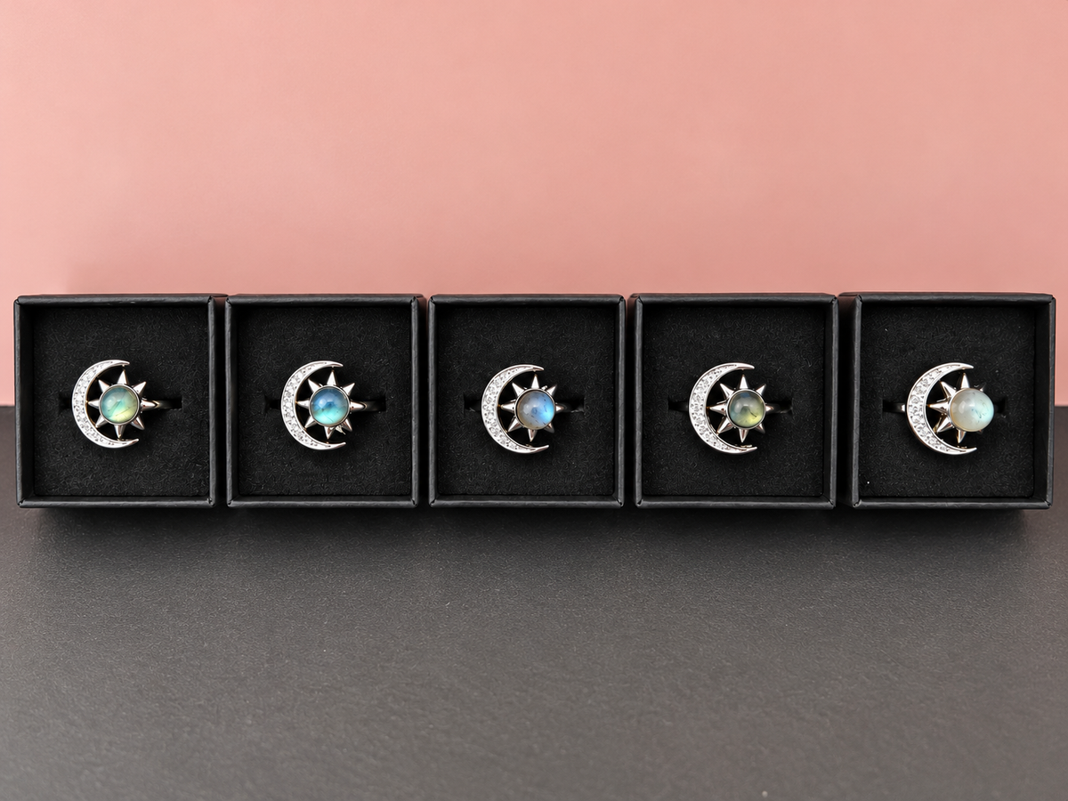 Five labradorite sun and moon rings displayed together