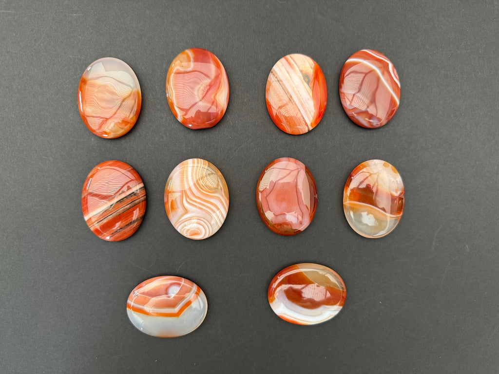 Banded Carnelian worry stones showing their individual patterns