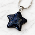 Blue Goldstone star pendant on silver-plated chain