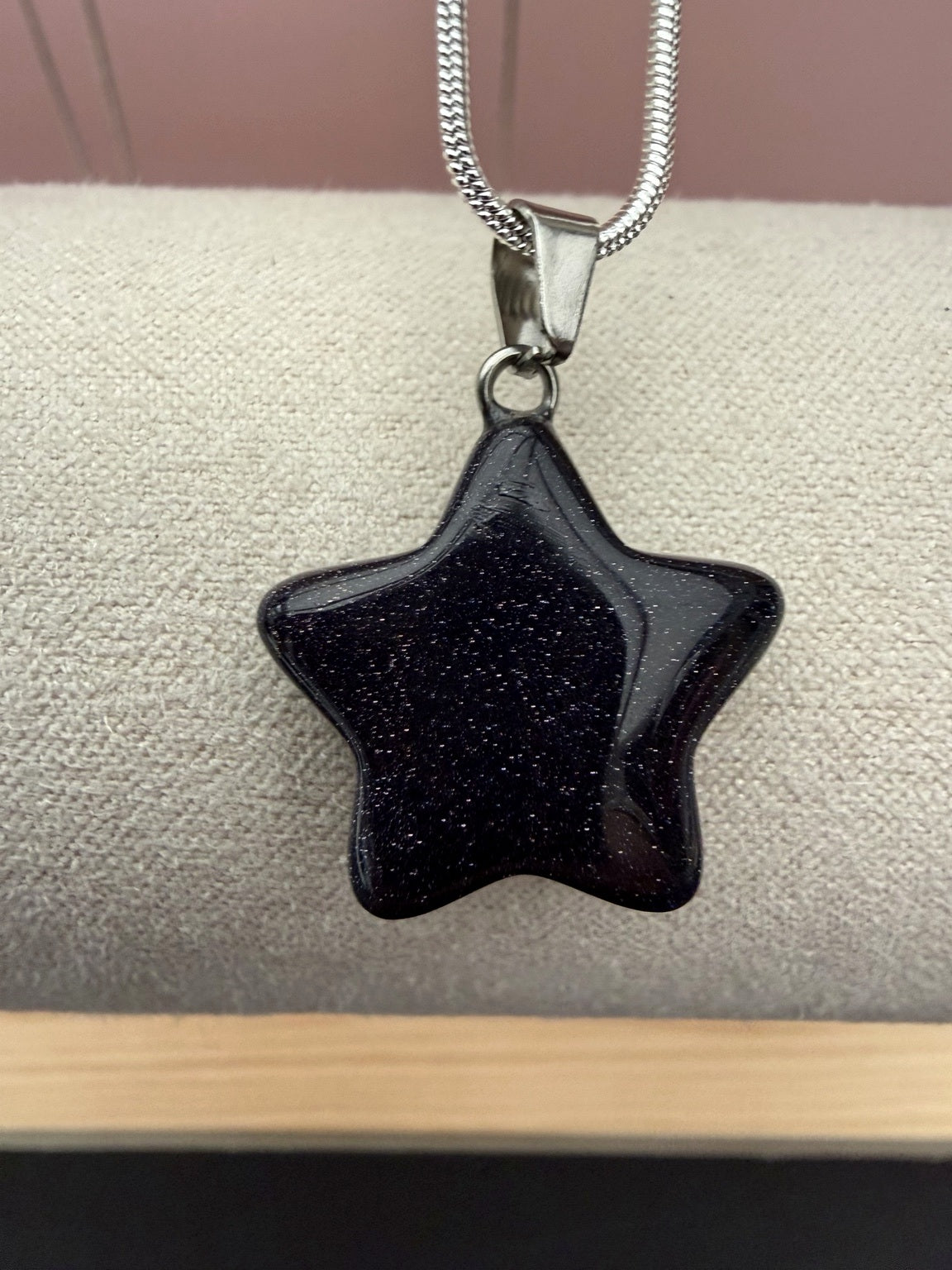 Blue goldstone star pendant close-up