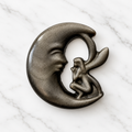 Silver Sheen Obsidian carved fairy in crescent moon - approx 55mm radius