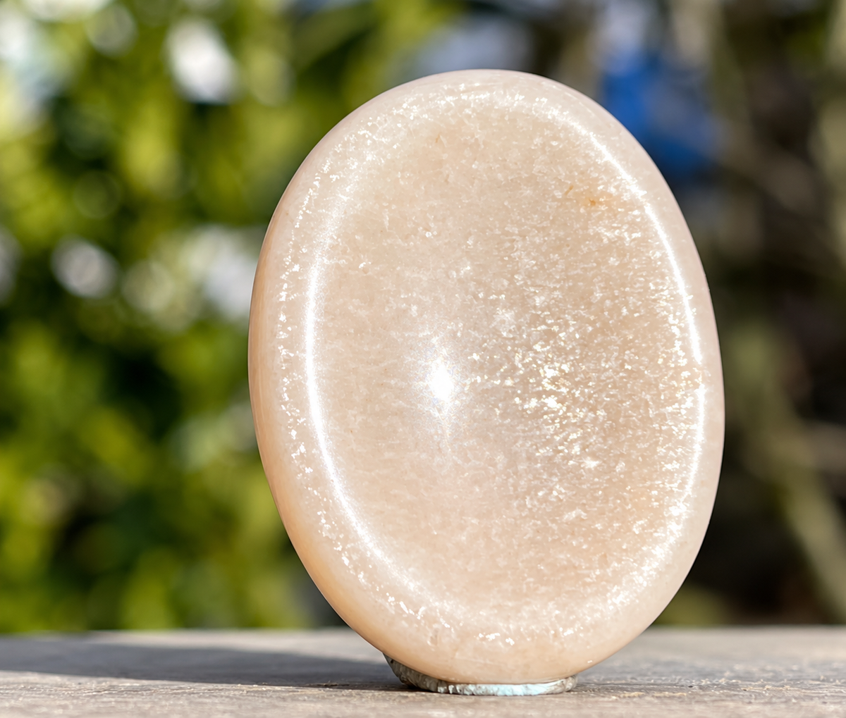 Moonstone palm worry stone close-up