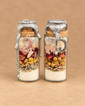 Two handmade Whispers of Moonlight spell jars showing available examples; sold individually